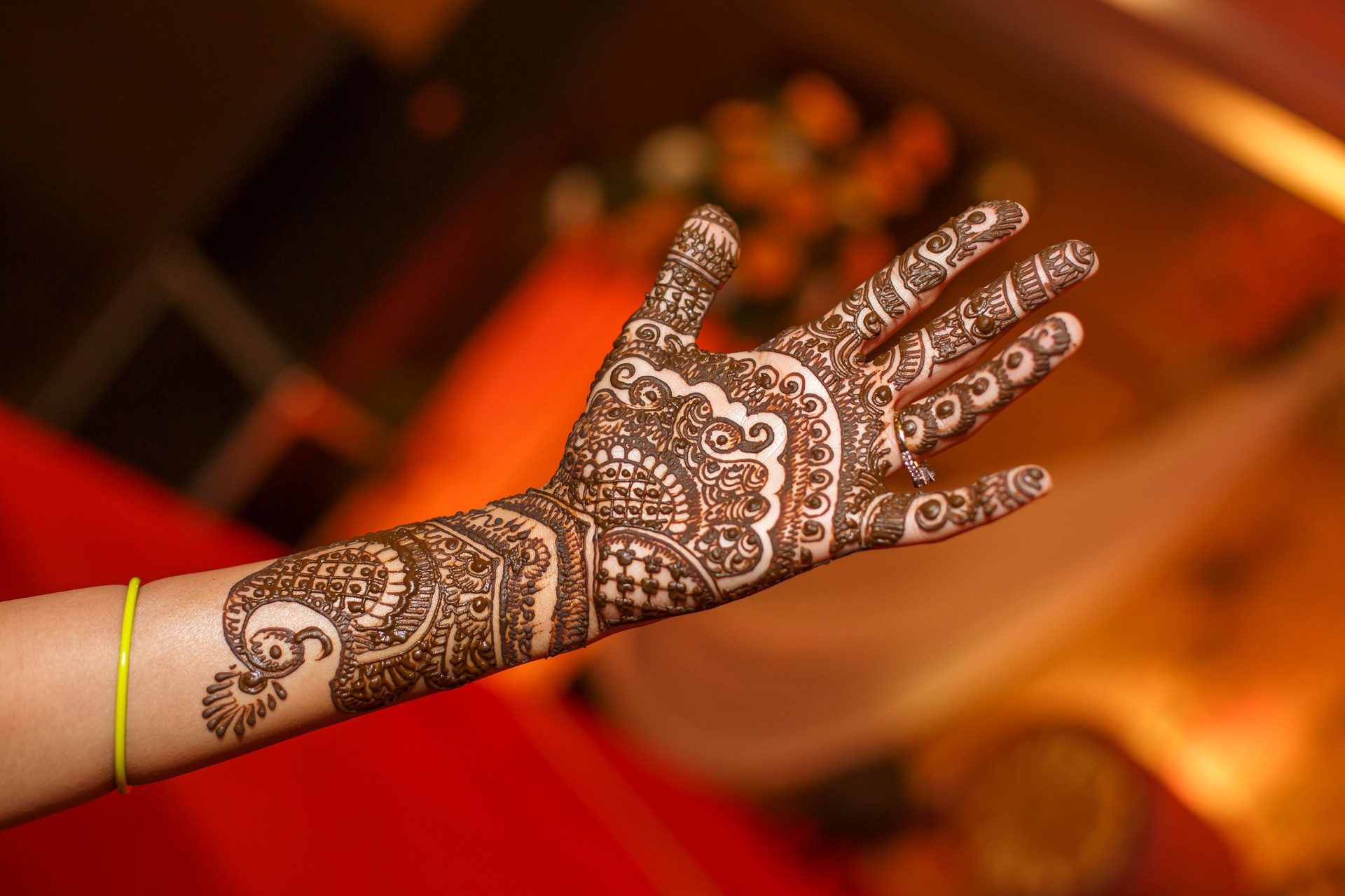 Human hand decorated with henna tattoo also called Mehendi